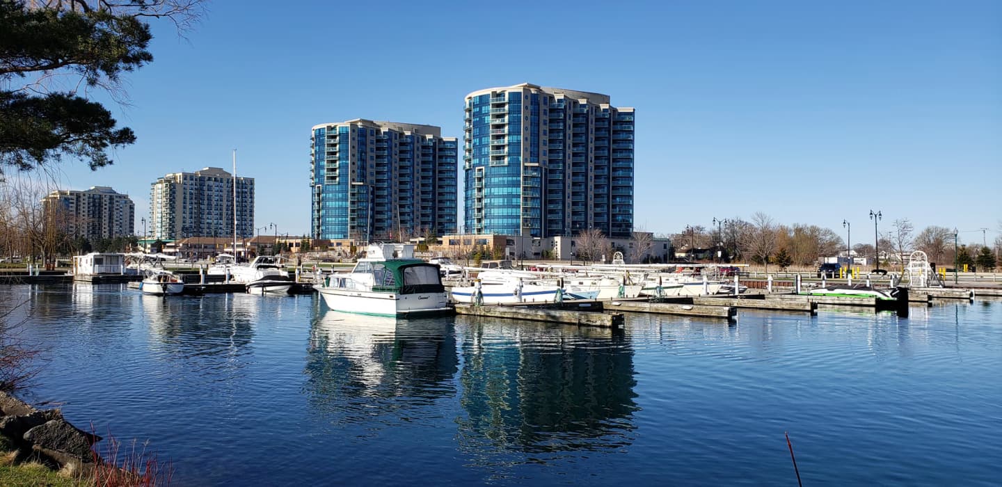 Marina with boats and tall buildings in Barrie, Ontario