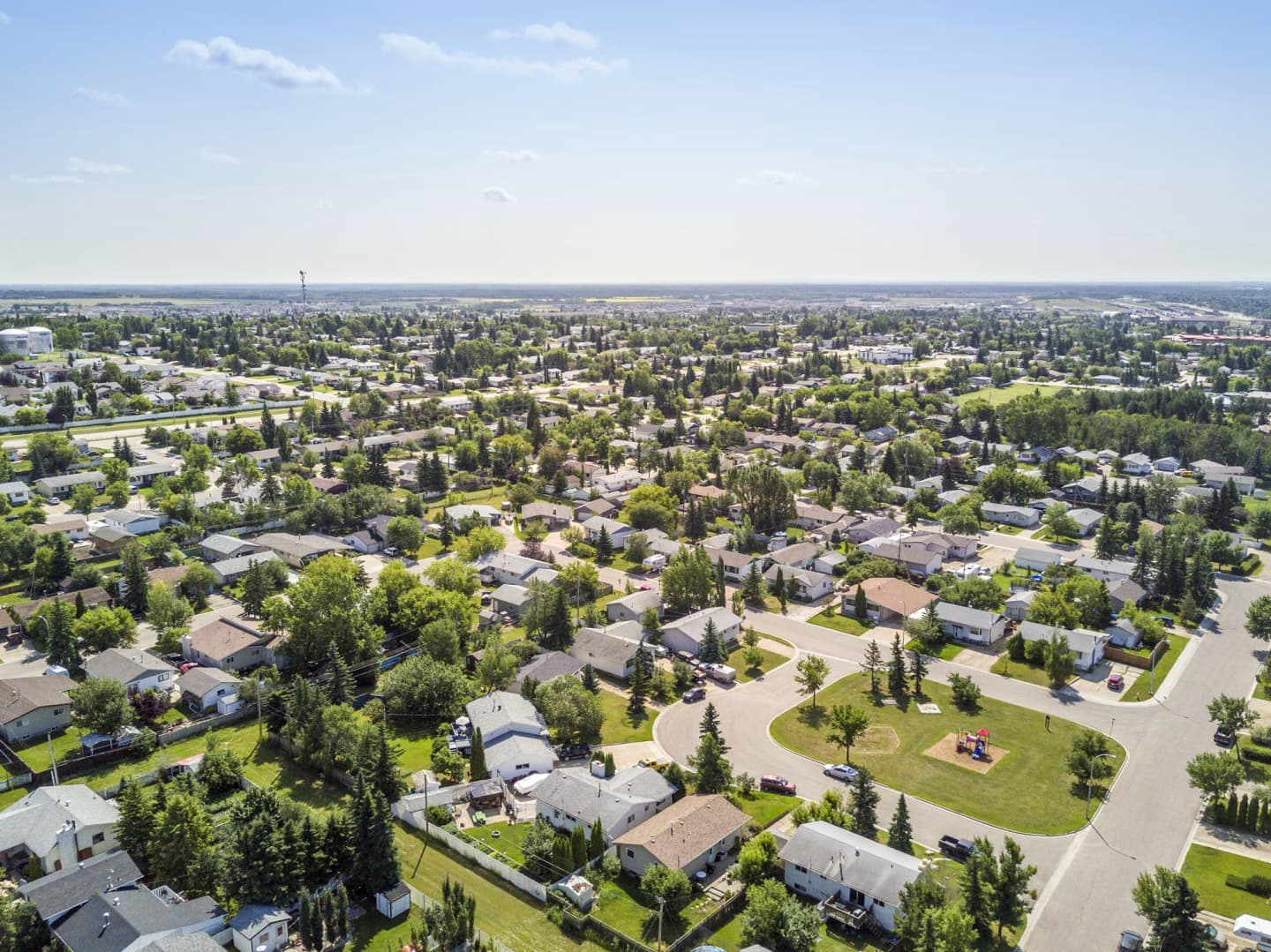 Aerial view of residential neighbourhoods in Grande Prairie on a sunny day.