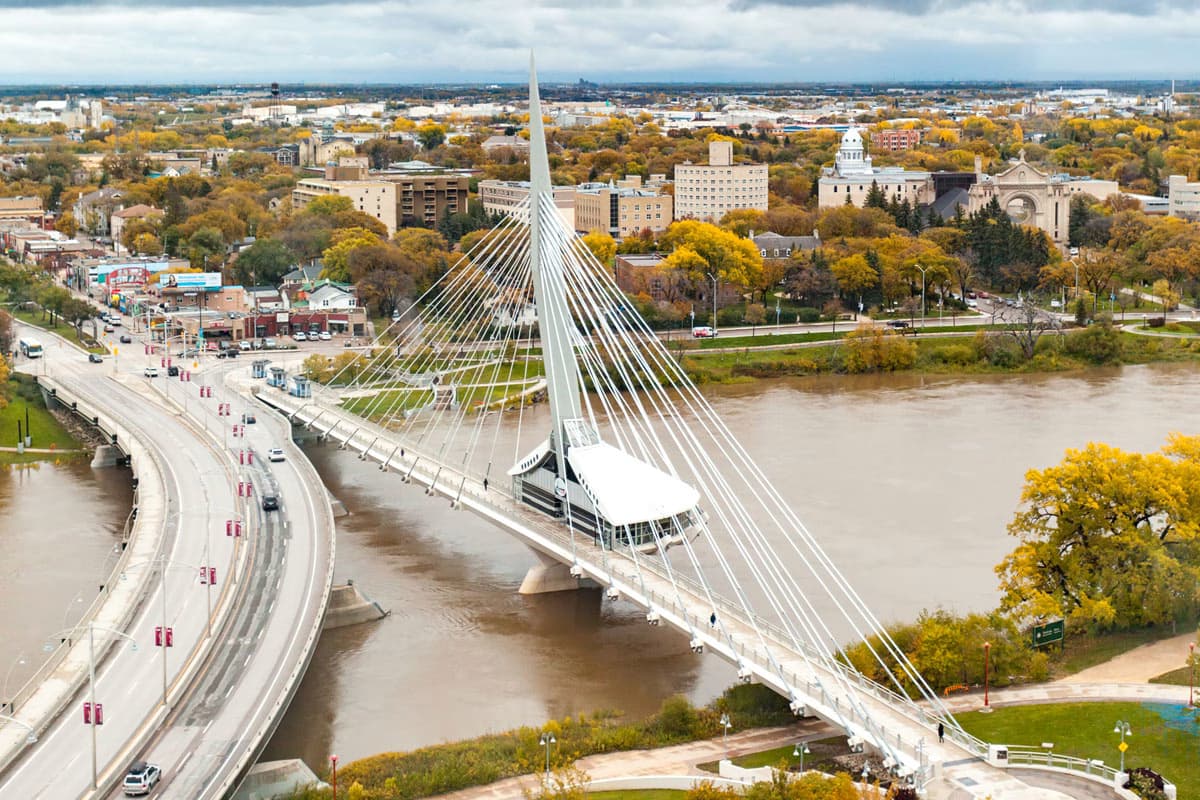 Aerial view of the Esplanade Riel pedestrian bridge over the Red River in Winnipeg, Manitoba.