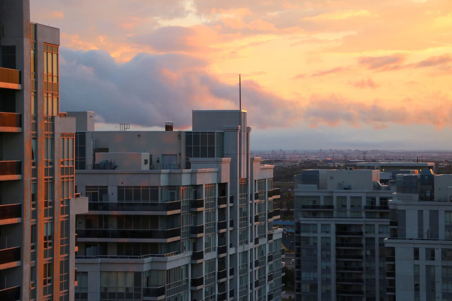 Modern high-rise buildings in Vaughan, Ontario, at sunset.