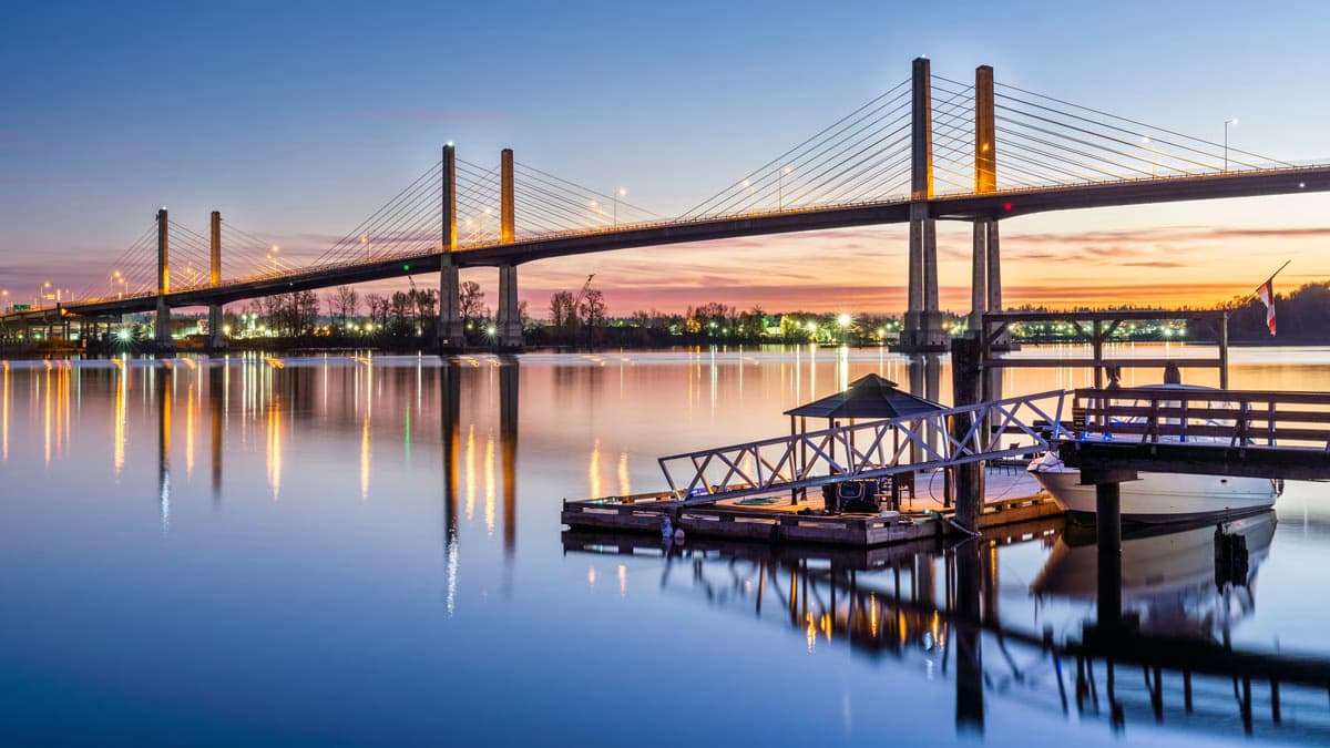 Bridge over calm water at sunset in Langley, British Columbia